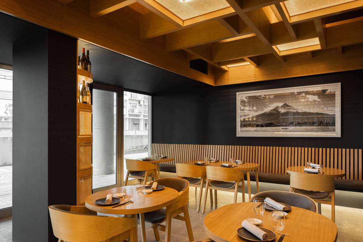 Fuji Restaurant in Portugal plays with light and shadows to create a warm setting exuding culture