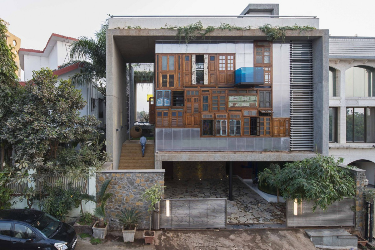 Reclaimed doors and windows make up the faÃ§ade of this innovative house