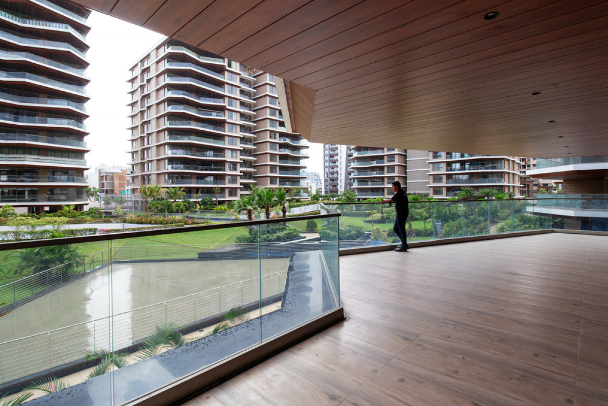 Large balconies act as interstitial spaces between the outside and the inside