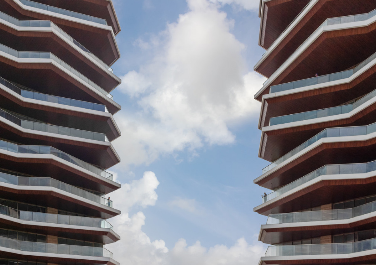 Varying angular balconies front each apartment