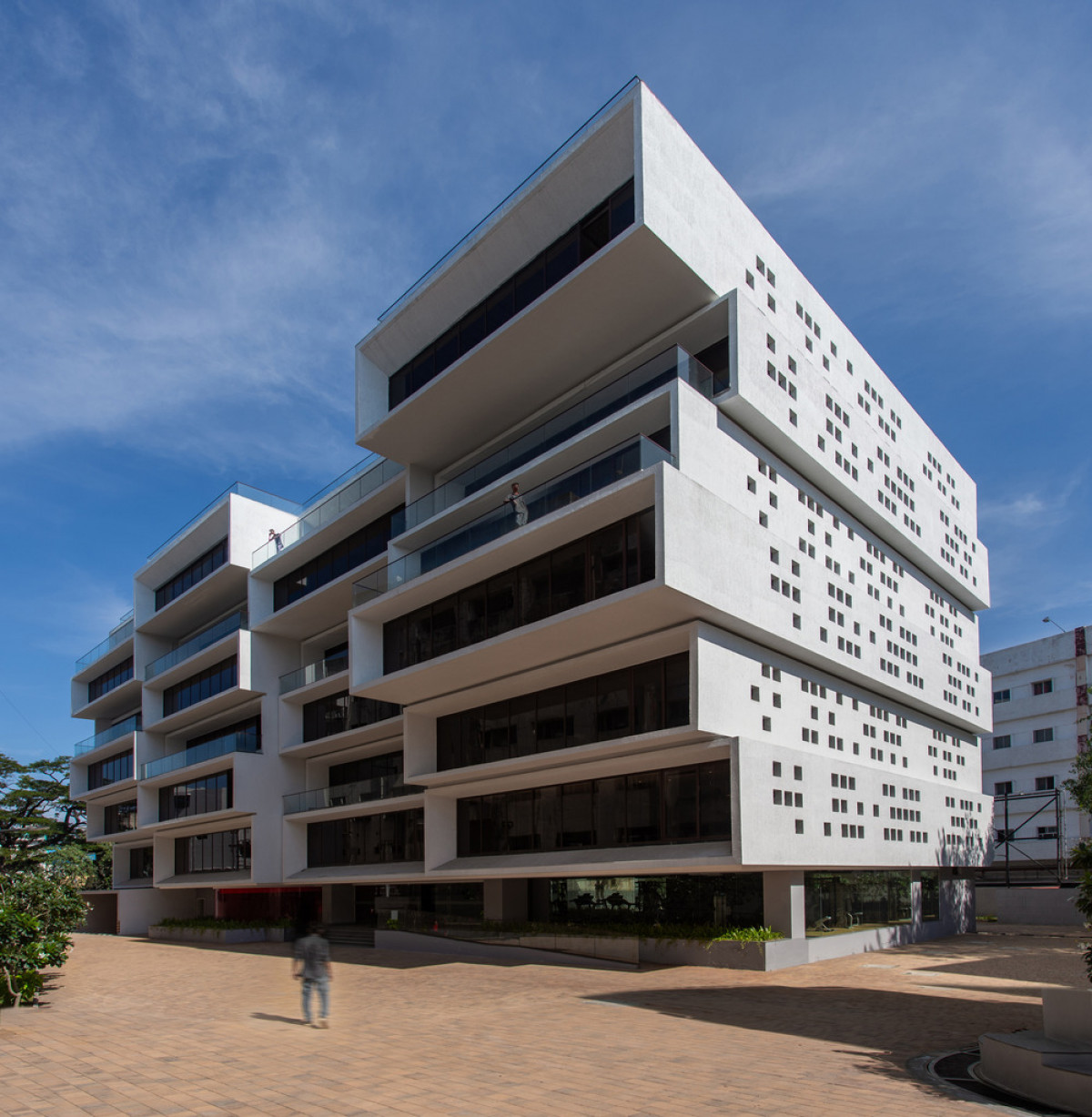 Cuboid cantilevered volumes create an office building with outdoor spaces at each level  Photo credit: BRS Sreenag, Sreenag Pictures