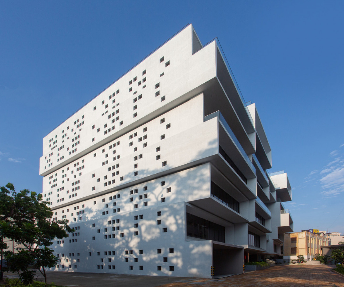 Cuboid cantilevered volumes create an office building with outdoor spaces at each level  Photo credit: BRS Sreenag, Sreenag Pictures