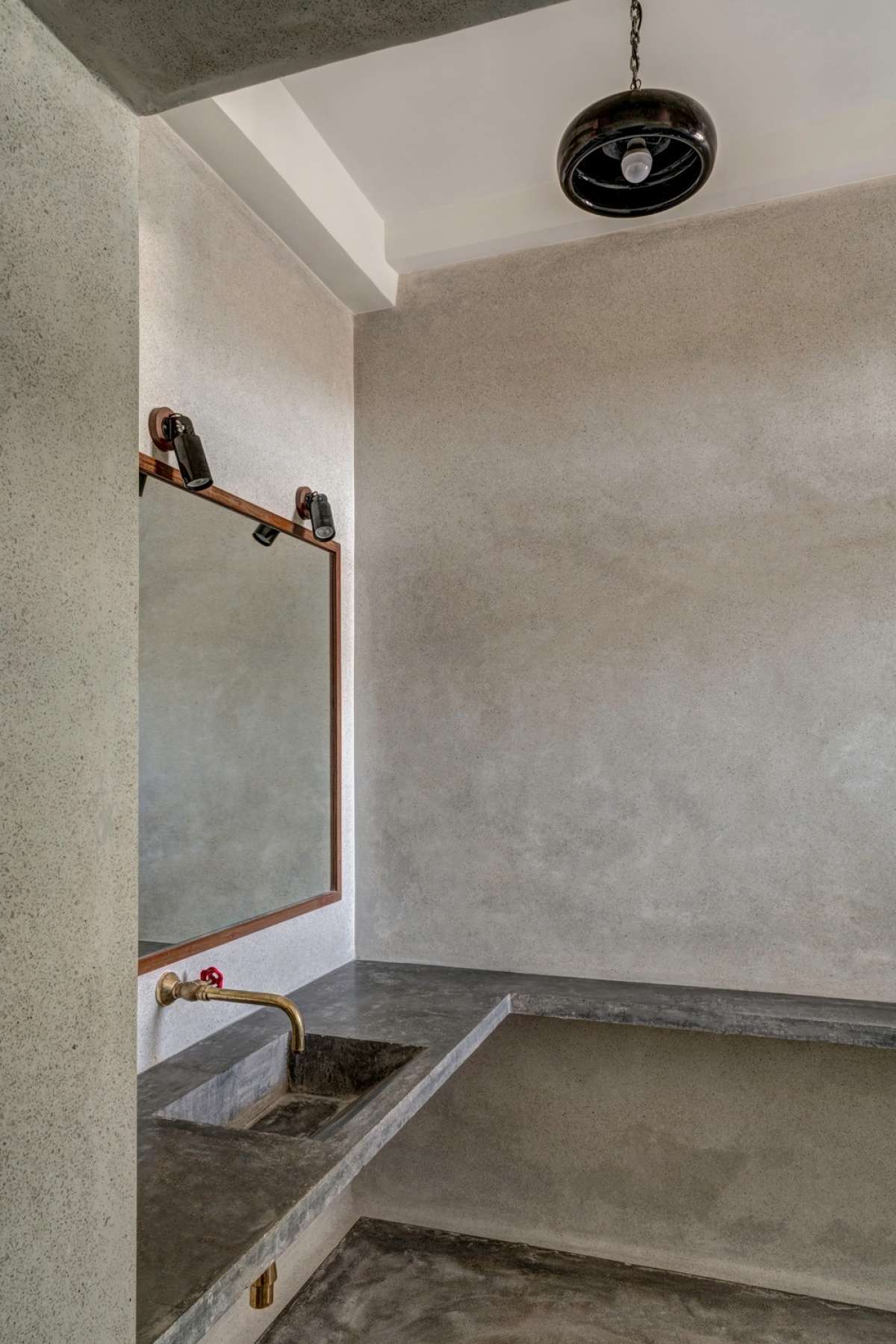 Master Bathroom vanity with in-situ concrete counter, terrazzo finish on walls and IPS flooring