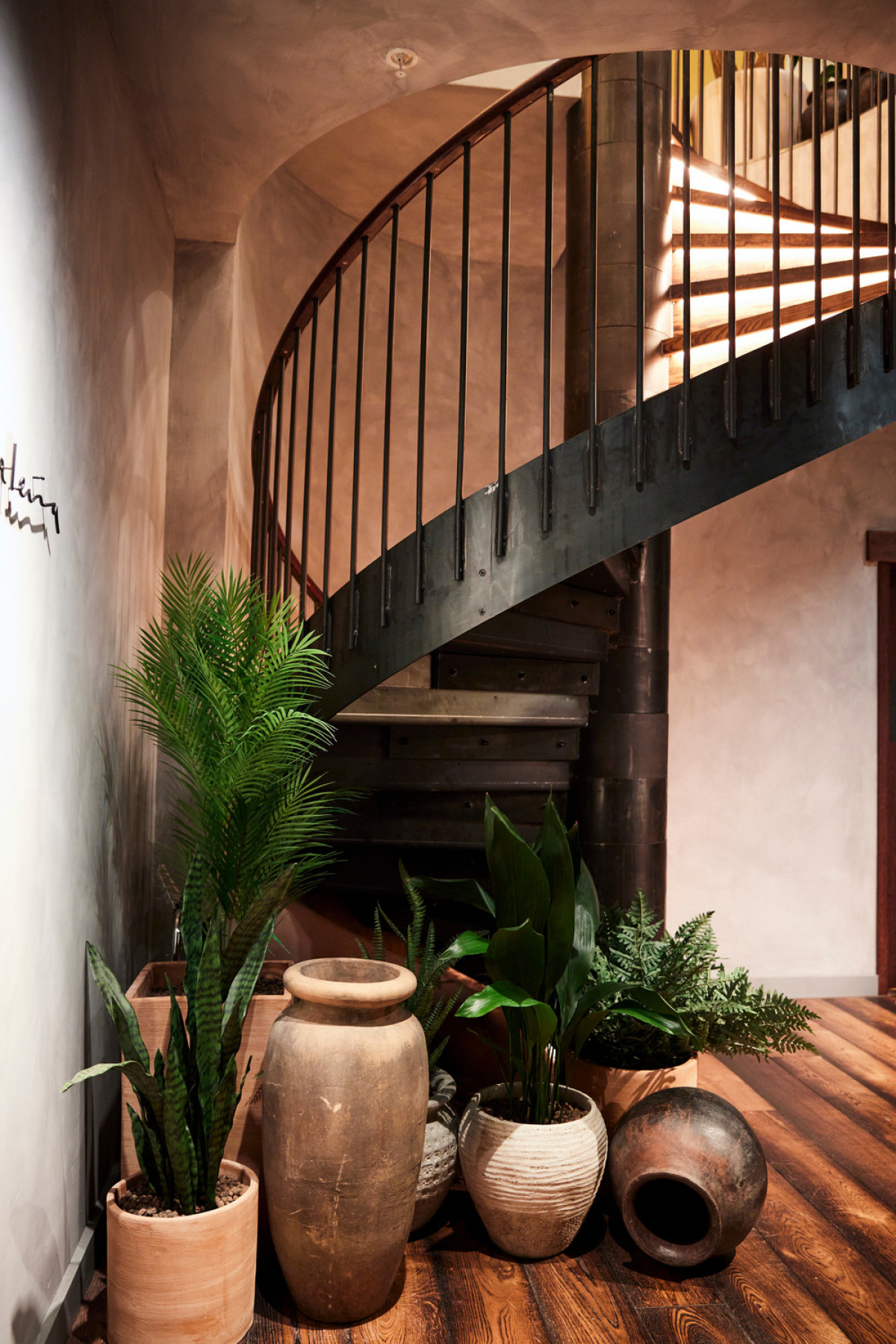 Blackened steel staircase and Mexican artefacts assemble | Photo credit: Charlie Mckay