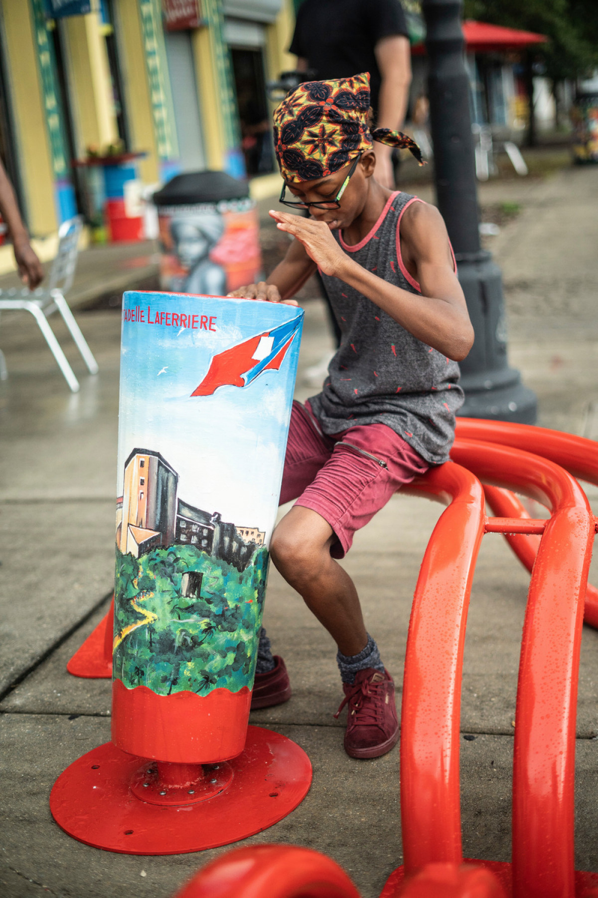 The intervention is made up of three aluminum drums formed from the traditional Rada Battery Haitian drums. They were hand-painted with traditional images of Haiti by local Haitian artist Serge Toussaint. Photo credit: Christopher Brickman
