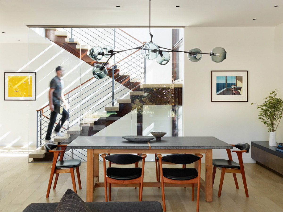   Butterfly House: The house—an International Design Award winner—features a glass wall-fronted stair that dynamically connects three levels of gathering areas, and private areas. Photo credit: Matthew Millman 