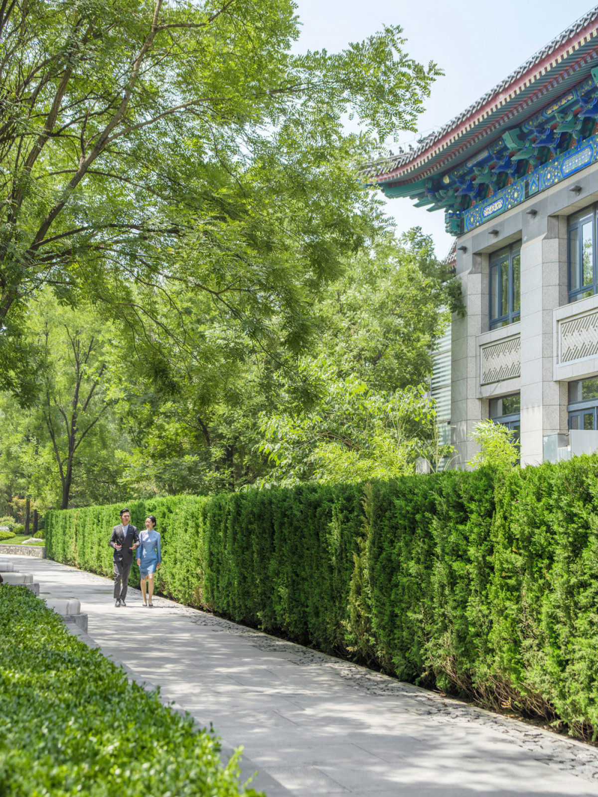 Hedge walls guide MAHA residents to their exclusive tower lobby entries. | Photo credit: LIN Banye