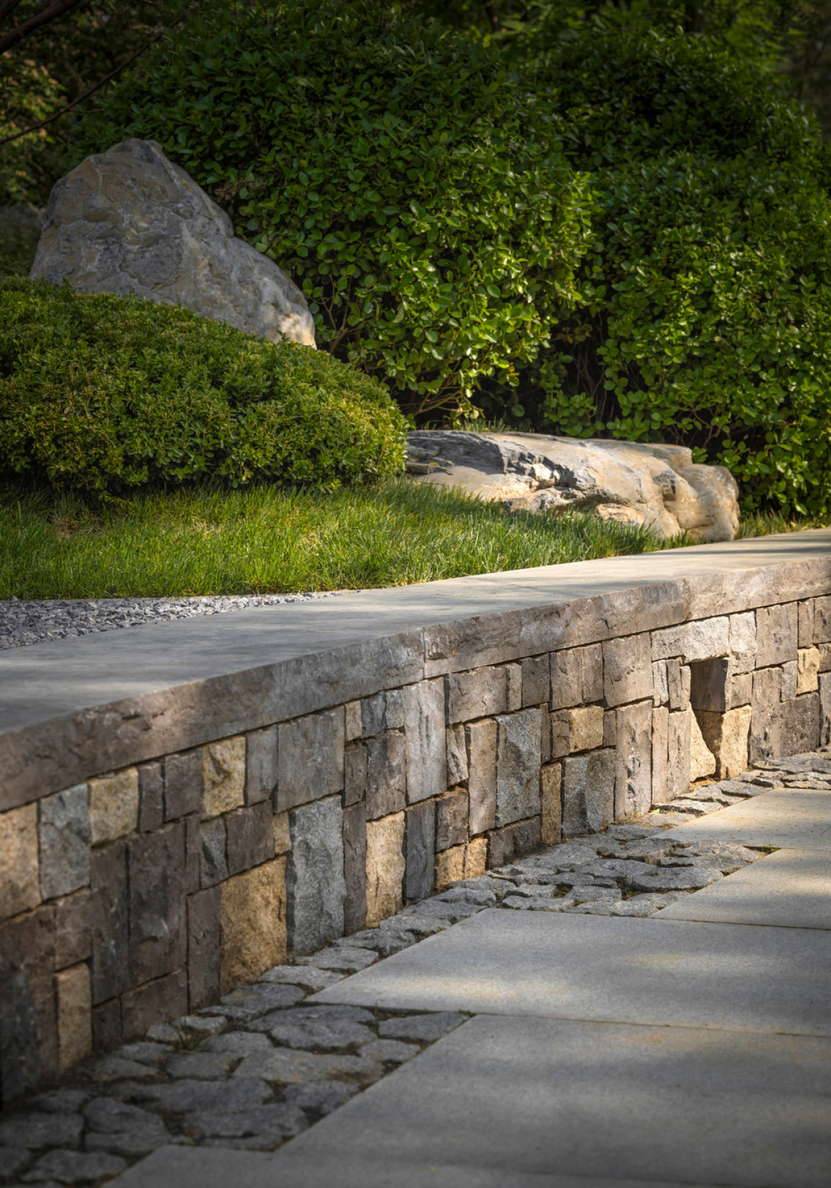 In regions where paths must be wide enough to allow for buggies to pass, this method of breaking down the paving allows for the path to be visually much smaller than its functional requirement mandates. | Photo credit: Jonathan Leijonhufvud