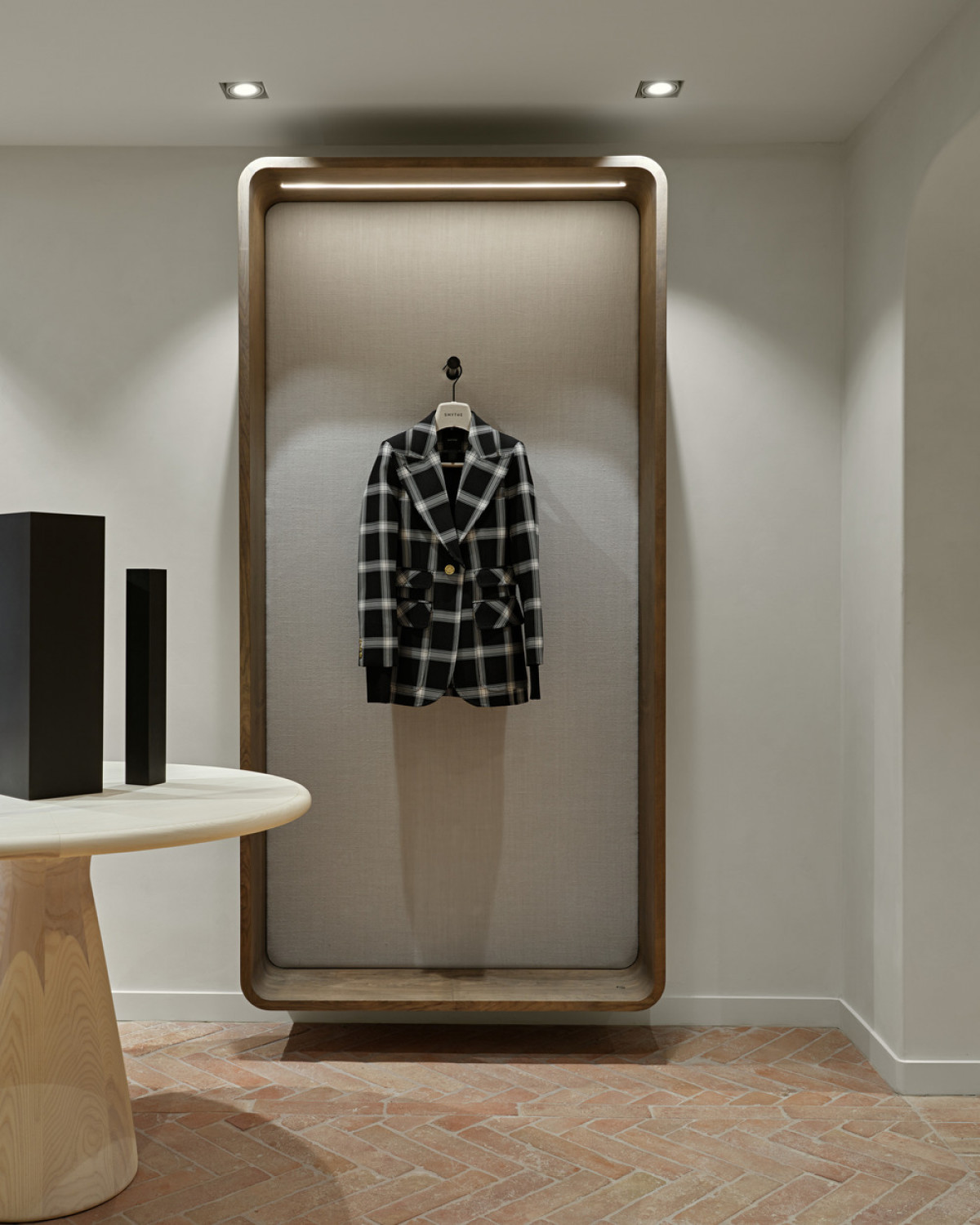 Wall-mounted feature boxes allow the sales team to easily style an outfit or show off a single garment.