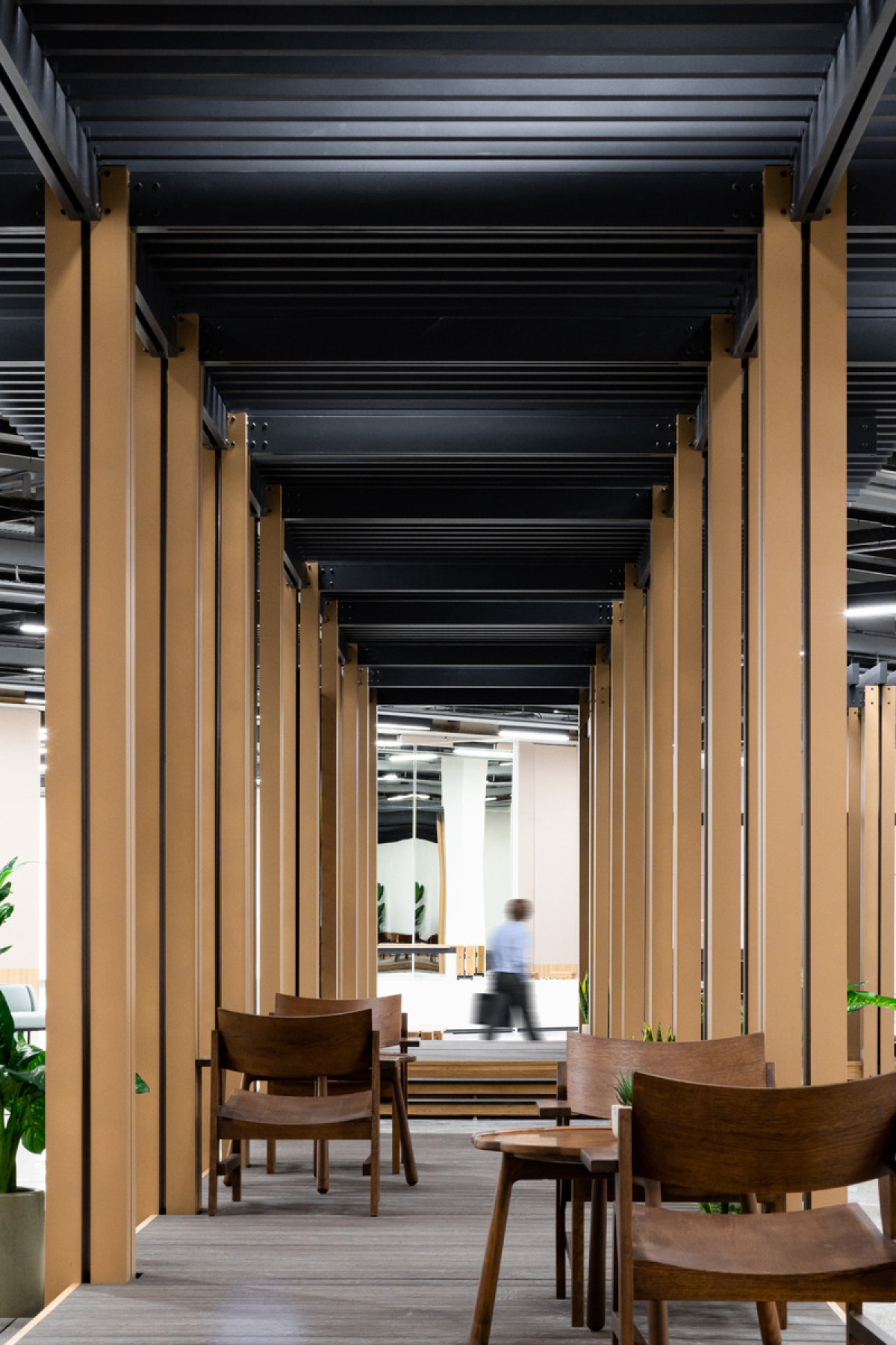This intricate network of elements allows for various configurations in terms of length, height, and function, enabling the furniture to adapt to different needs and spaces. Photo credit: Dennis Cheung @ Studio RYTE