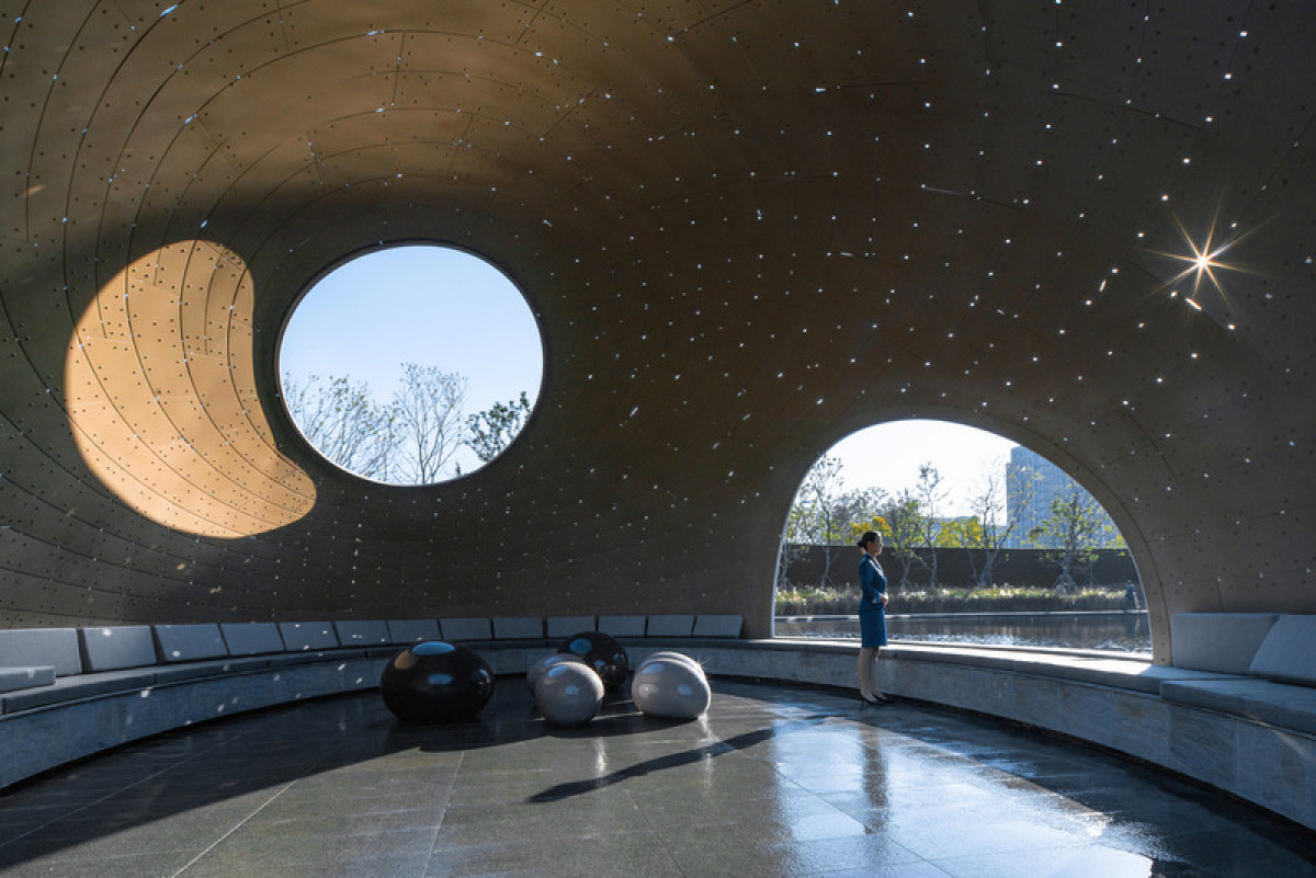 Tiny openings embedded in the woven gaps allow light to penetrate, creating a luminous array that forms dynamic patterns reflecting the dome's rotating structural lines. Gazing upwards, it resembles the flowing river of stars. Photo credit: Photo by Fancy
